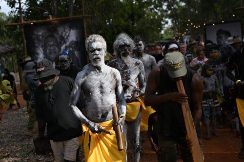 epa12276393 Members of the Gumatj clan of the Yolngu people from north-eastern Arnhem Land arrive to perform the Bunggul traditional dance during the 25th annual Garma Festival in Gulkula, Northern Territory, Australia, 01 August 2025. Garma Festival, Australia's most significant Indigenous cultural gathering, is held each year on Yolŋu Country in northeast...