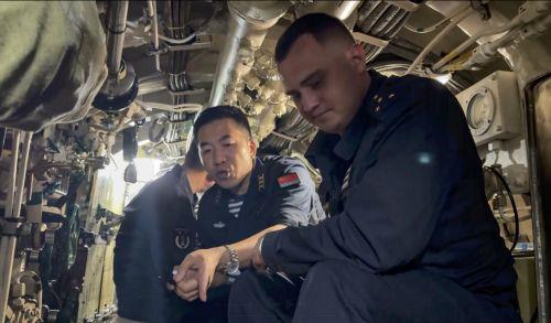 epa12283965 A still image taken from a handout video provided by the press service of the Russian Ministry of Defence shows Chinese and Russian naval sailors taking part in joint search and rescue drills in the Sea of Japan, near Vladivostok, Russia, 05 August 2025, as part of the 'Maritime Interaction 2025' exercises. The Russian Navy and Chinese Navy...