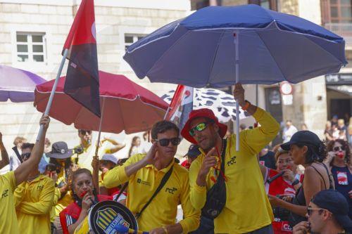 epa12316544 Lifeguards protest for better working conditions outside the City Hall in Barcelona, northeastern Spain, 22 August 2025. Barcelona's lifeguards are on a strike since 01 August 2025.  EPA/Quique Garcia