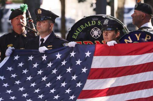 epa12369499 An American flag is presented during the start of the 24th anniversary 9/11 Commemoration Ceremony at the 9/11 Memorial in New York, New York, USA, 11 September 2025.  EPA/SARAH YENESEL
