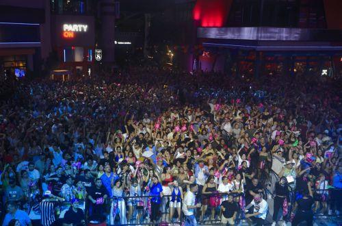 epa12394608 People watch the broadcast of Bad Bunny's concert at the T-Mobile District in San Juan, Puerto Rico, 20 September 2025. Bad Bunny concluded his musical residency, 'No Me Quiero Ir De Aqui: Una Mas,' at the Coliseo de Puerto Rico with an additional and 31st show, turning the event into a public celebration. The concert was broadcast across...