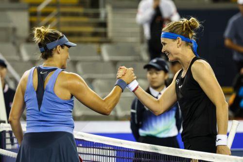 epa12402120 Marie Bouzkova (R) of Czech Republic shakes hands with Tatjana Maria of Germany after winning their first round match in the China Open tennis tournament in Beijing, China, 24 September 2025.  EPA/WU HAO