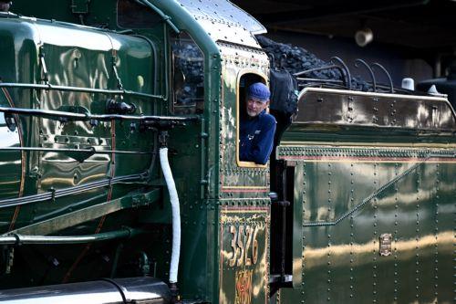 epa12406656 Driver Alex Claassens poses for a photograph as he prepares the 3526 steam locomotive ahead of its departure from Central Station in Sydney, Australia, 26 September 2025. Friday, 26 September 2025 marks 170 years since New South Wales launched its first passenger railway line, connecting Sydney and Parramatta.  EPA/DAN HIMBRECHTS AUSTRALIA AND...