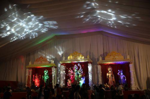 epa12414619 People visit a makeshift Puja pandal and rituals during the four-day Durga Puja festival in Dhaka, Bangladesh, 29 September 2025. The Durga Puja 2025 will take place in Bangladesh from 29 September to 02 October. The festival celebrates goddess Durga as the motherly power behind creation, as well as her victory over the demon Mahishasura. ...