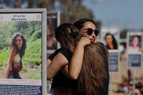 epaselect epa12436537 Israeli family members visintg the memorials at the site of the Nova music festival, near Re'im, on the second anniversary of the 07 October 2023 Hamas attacks, near the Gaza border, southern Israel, 07 October 2025. October 07 marks two years since the Palestinian militant group Hamas launched a surprise attack on Israel, taking...