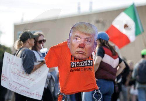 epa12449607 Activists attend a demonstration outside the ICE detention facility in Broadview, around 12 miles west of Chicago, Illinois, USA, 12 October 2025. The demonstrations against the US Immigration and Customs Enforcement (ICE) are rooted in concerns about civil rights, local community safety, and alleged overreach by federal enforcement. ...