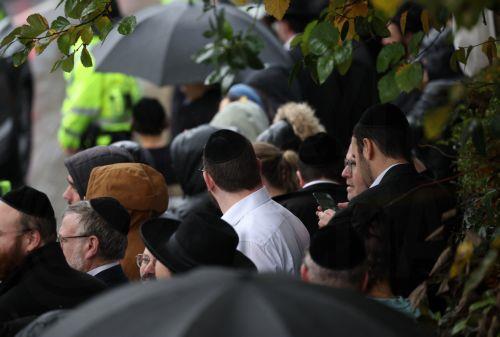 epa12467415 Members of the Jewish community line the streets outside Heaton Park Hebrew Congregation Synagogue during a visit by Britain’s King Charles III in Manchester, Britain, 20 October 2025. Heaton Park Hebrew Congregation Synagogue was the site of a deadly car and stabbing terror attack on 02 October 2025, in which two victims and the attacker died. ...