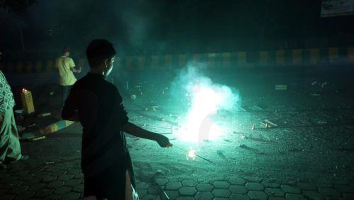epa12468330 People light sparklers and crackers during Diwali celebrations near New Delhi, India, 20 October 2025. Diwali, the Hindu festival of lights symbolizing the victory of good over evil and marking Lord Rama's return to Ayodhya after 14 years of exile, is celebrated with fireworks. However, the celebrations severely impact Delhi's air quality, with...