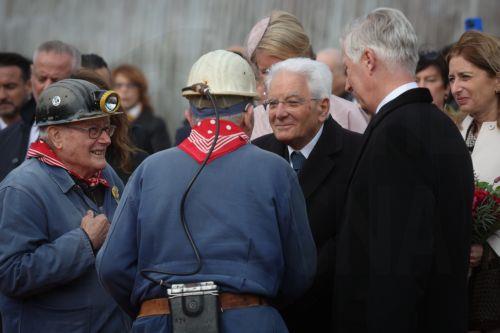 epa12469764 Italy's President Sergio Mattarella (2-R) and King Philippe (R) of Belgium speak with old miners during a visit to the Bois du Cazier, a former coal mine in the Marcinelle district of Charleroi, Belgium, 21 October 2025, as part of a state visit. On 08 August 1956, a major mining disaster occurred at the Bois du Cazier coal mine, killing 262...