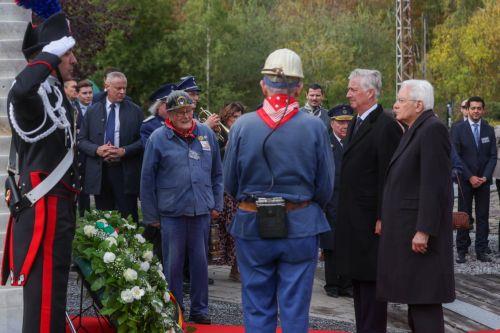epa12469767 Italy's President Sergio Mattarella and King Philippe of Belgium, along with old  miners, pay tribute during a visit to the Bois du Cazier, a former coal mine in the Marcinelle district of Charleroi, Belgium, 21 October 2025, as part of a state visit. On 08 August 1956, a major mining disaster occurred at the Bois du Cazier coal mine, killing...