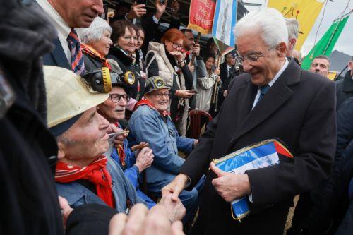 epa12469768 Italy's President Sergio Mattarella, along with old miners, pays tribute during a visit to the Bois du Cazier, a former coal mine in the Marcinelle district of Charleroi, Belgium, 21 October 2025, as part of a state visit. On 08 August 1956, a major mining disaster occurred at the Bois du Cazier coal mine, killing 262 men, most of them Italian...