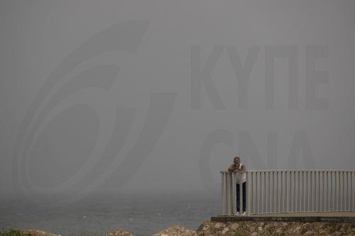 epa12471602 A person observes the sea in Santo Domingo, Dominican Republic, 21 October 2025. The Dominican Republic activated emergency plans in response to heavy rainfall forecast from Tropical Storm Melissa, which formed in the Caribbean Sea and triggered warnings for the Dominican Republic, Haiti, and Jamaica.  EPA/ORLANDO BARRIA