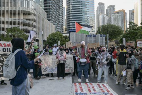 epa12483629 Protesters display placards during a protest rally against US President Donald Trump's visit to Malaysia to attend the Association of Southeast Asian Nations (ASEAN) Summit at Ampang Park in Kuala Lumpur, Malaysia, 26 October 2025. Protesters gathered to oppose President Trump’s visit for the 47th ASEAN Summit.  EPA/AFFAN FAUZI
