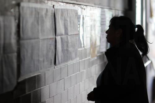 epa12483701 People check the legislative candidates list at a polling station in Buenos Aires, Argentina, 26 October 2025. Argentina is holding nationwide legislative elections.  EPA/JUAN IGNACIO RONCORONI