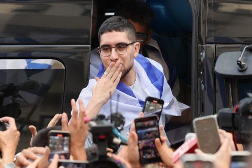 epa12483937 Released Israeli hostage Evyatar David waves to crowds as he returns to his home after completing hospitalization and treatment period, in Kfar Sava, Israel, 26 October 2025. Evyatar David was kidnapped by Hamas from the Nova music festival at the Gaza border 07 October 2023 and released during a ceasefire agreement between Hamas and Israel. The...
