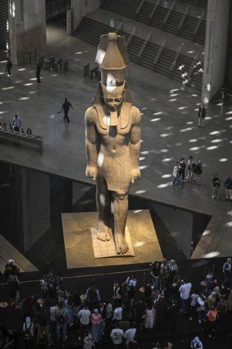 epa12502304 The Statue of Ramesses II stands on display in the Grand Hall of the Grand Egyptian Museum during the museum's opening to the public in Giza, Egypt, 04 November 2025. Located on the Giza Plateau, the Grand Egyptian Museum is recognized as the world's largest archaeological museum dedicated to a single culture, and is home to more than 100,000...