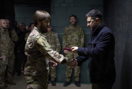 epa12502402 A handout photo made available by the Ukrainian Presidential Press Service shows Ukraine's President Volodymyr Zelensky handing awards to servicemen during his working visit to the frontline in the Donetsk region, eastern Ukraine, 04 November 2025, amid the Russian invasion. The Ukrainian president met with the military at the command post of...