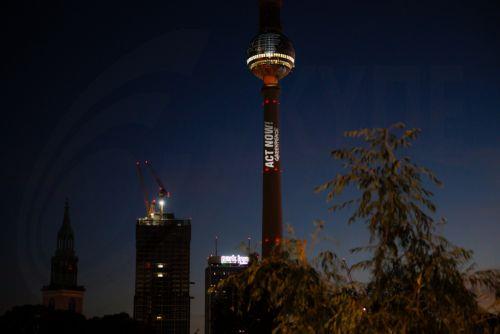 epa12506980 Activists from the environmental protest organization Greenpeace demonstrate with a projection onto the TV Tower in Berlin, Germany, 06 November 2025. Ahead of the World Climate Conference 'COP30', taking place in Brazil, Greenpeace activists projected a burning globe and the slogan 'Act Now!' onto the TV Tower.  EPA/CLEMENS BILAN