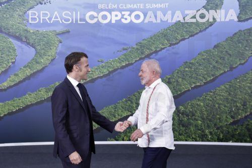 epa12509532 Brazilian President Luiz Inacio Lula da Silva (R) greets French President Emmanuel Macron at the opening of the COP30 leaders' summit in Belem, Brazil, 06 November 2025. The COP30 Leaders' Summit precedes the main 30th United Nations Climate Change Conference in Belem, Brazil. The conference, running from 10 to 21 November is strategically...