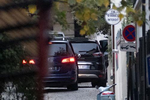 epa12516345 Former French President Nicolas Sarkozy (R) arrives by car at his house after leaving La Sante prison following a court decision to release him, in Paris, France, 10 November 2025. A French appeals court approved a request for an early release of Sarkozy, who was sentenced to five years in jail for his role in the case involving funds from...