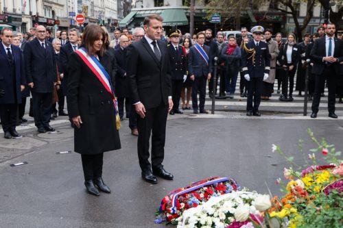 epa12522892 French Prime Minister Sebastien Lecornu (L), Interior Minister Laurent Nunez (2-L), and Justice Minister Gerald Darmanin (3-L) look on behind Paris' mayor Anne Hidalgo (C-L) and France's President Emmanuel Macron (C-R) during a ceremony in tribute to the victims at an intersection near Cafe Bonne Biere, one of the sites targeted in the November...