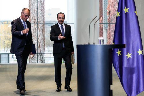 epa12525986 German Chancellor Friedrich Merz (L) and Cypriot President Nikos Christodoulides (R) arrive at a press conference at the Federal Chancellery in Berlin, Germany, 14 November 2025. Christodoulides' visit aims to present to Merz the main pillars of Cyprus's EU presidency program, including EU defense, border management, and support for EU...