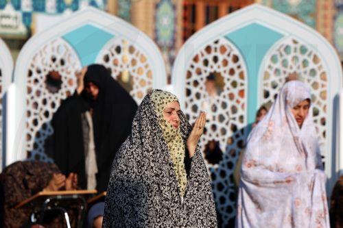 epa12526094 Iranian women pray during the rainfall prayer at the Saleh Shrine in northern Tehran, Iran, 14 November 2025. Iranians held a prayer for the rainfall in many cities across the country as Iran is facing water shortage crisis.  EPA/ABEDIN TAHERKENAREH