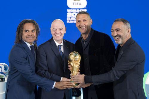 epa12537749 (from L) Christian Karembeu, FIFA President Gianni Infantino, Marco Materazzi and Youri Djorkaeff pose with the FIFA World Cup trophy during the FIFA World Cup 2026 play-offs draw at the Home of FIFA in Zurich, Switzerland, 20 November 2025.  EPA/CLAUDIO THOMA