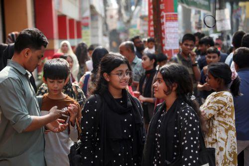 epa12539705 Local residents rush out into the streets after an earthquake, in Dhaka, Bangladesh, 21 November 2025. According to the Directorate General of Health Services (DGHS), at least three people died and scores were injured on the morning of 21 November when a magnitude 5.7 earthquake struck near Narsingdi, east of Dhaka. Most casualties resulted from...