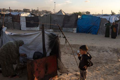 epa12562563 Displaced Palestinian women and children live at a temporary makeshift camp set up in Khan Younis, southern Gaza Strip, 01 December 2025, amid a ceasefire between Israel and Hamas. Around 1.9 million people in Gaza, nearly 90 percent of the population, have been displaced since the Israel-Hamas conflict began in October 2023, according to the...