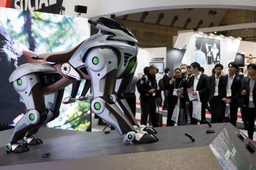 epa12566635 Visitors look at the Kawasaki CORLEO, a four-legged robotic concept vehicle, at the Kawasaki booth during the International Robot Exhibition 2025 (iREX2025) in Tokyo, Japan, 03 December 2025. Held once every two years, the iREX is one of the world’s largest robot trade shows. For the 2025 edition, 673 companies and organizations will be...