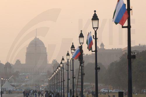epa12566846 An Indian worker installs Indian and Russian flags on poles ahead of Russian President Vladimir Putin's visit at Rajpath in New Delhi, India, 03 December 2025. Vladimir Putin is scheduled for a two-day official visit to India on 04–05 December 2025.  EPA/RAJAT GUPTA