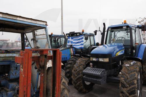 epa12566906 Tractors lined up at the Malgara toll road, as part of the nationwide farmers' mobilization in Thessaloniki, Greece, 03 December 2025. At the Malgara toll station on the Thessaloniki–Athens National Road, farmers from the Municipality of Delta and the surrounding area have been blocking the road to Athens since 01 December, while the road to...