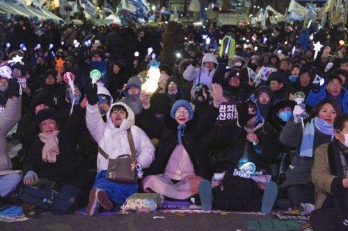 epa12566958 South Korean people participate in a demonstration to mark the first anniversary of the 03 December martial law crisis outside the National Assembly in Seoul, South Korea, 03 December 2025.  EPA/JEON HEON-KYUN