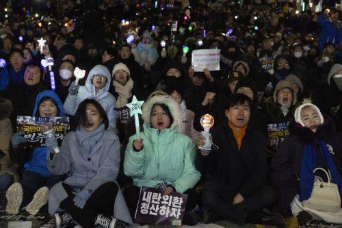 epa12566960 South Korean people participate in a demonstration to mark the first anniversary of the 03 December martial law crisis outside the National Assembly in Seoul, South Korea, 03 December 2025.  EPA/JEON HEON-KYUN