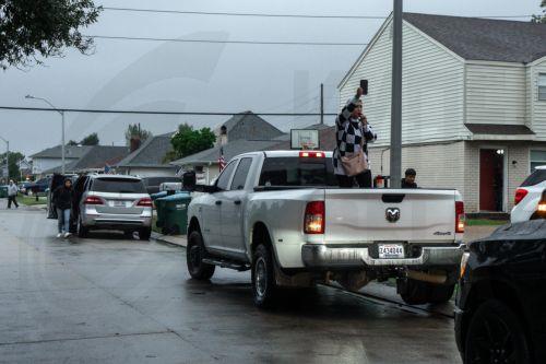epaselect epa12570719 A person blows a whistle to alert her neighbors of presence of federal agents near an elementary school in Kenner, Louisiana, USA, 04 December 2025. About 250 federal Border Patrol agents are deployed to New Orleans and surrounding areas as part of Trump administration ongoing crackdown on undocumented immigration.  EPA/OLGA FEDOROVA