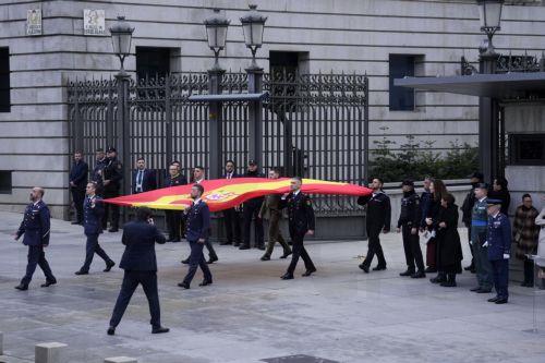 epa12573751 Soldiers and officials participate in a flag-raising ceremony during the celebration of Constitution Day at the Lower House in Madrid, Spain, 06 December 2025. Spain celebrates Constitution Day every year on 06 December, marking the day that its constitution was ratified in 1978.  EPA/Borja Sanchez-Trillo