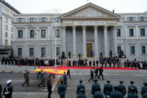 epa12573752 Soldiers and officials participate in a flag-raising ceremony during the celebration of Constitution Day at the Lower House in Madrid, Spain, 06 December 2025. Spain celebrates Constitution Day every year on 06 December, marking the day that its constitution was ratified in 1978.  EPA/Borja Sanchez-Trillo