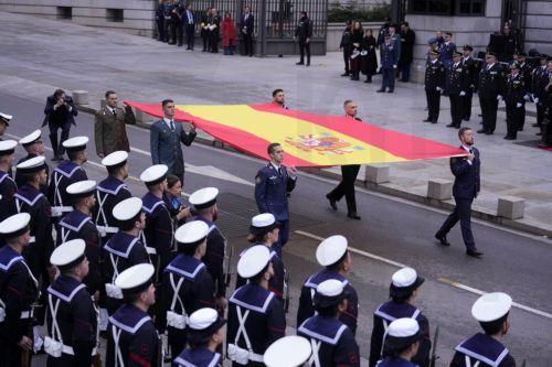 epa12573753 Soldiers and officials participate in a flag-raising ceremony during the celebration of Constitution Day at the Lower House in Madrid, Spain, 06 December 2025. Spain celebrates Constitution Day every year on 06 December, marking the day that its constitution was ratified in 1978.  EPA/Borja Sanchez-Trillo