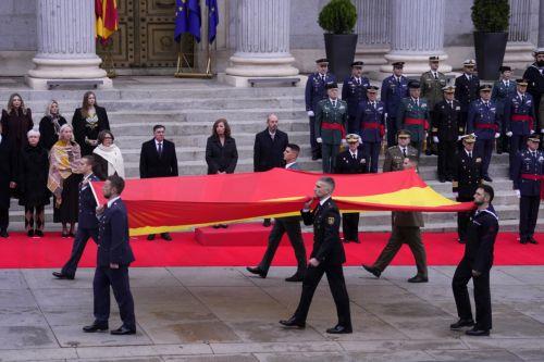 epa12573754 Soldiers and officials participate in a flag-raising ceremony during the celebration of Constitution Day at the Lower House in Madrid, Spain, 06 December 2025. Spain celebrates Constitution Day every year on 06 December, marking the day that its constitution was ratified in 1978.  EPA/Borja Sanchez-Trillo