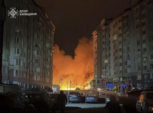 epa12573809 ​A handout photo made available by the State Emergency Service shows a fire in a residential area after Russian missiles and drone strikes in the Kyiv region of Ukraine, 06 December 2025, amid the ongoing Russian invasion. At least eight people were injured after Russian shelling overnight in Ukraine, with 51 missiles of different types and 653...