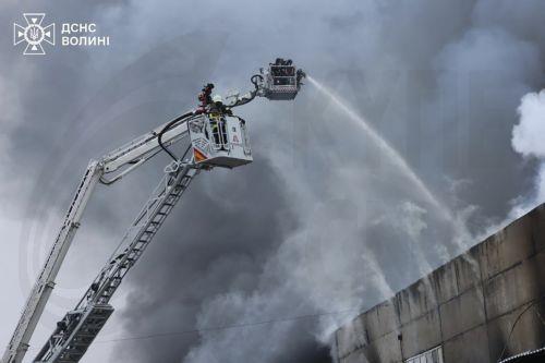 epa12573828 ​A handout picture made available by the State Emergency Service shows Ukrainian rescuers extinguishing a fire after Russian missiles and drone strikes in the Volyn Oblast, Ukraine, 06 December 2025, amid the ongoing Russian invasion. At least eight people were injured after Russian shelling overnight in Ukraine, with 51 missiles of different...