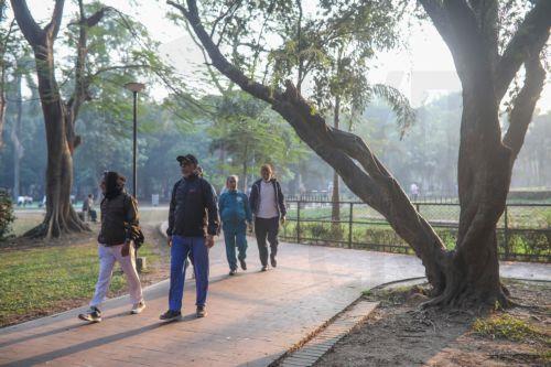 epa12576216 People take a stroll during the early winter morning at Ramna Park in Dhaka, Bangladesh, 07 December 2025. Ramna Park is a large recreation area situated at the heart of the central Dhaka.  EPA/MONIRUL ALAM