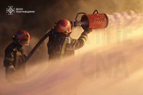 epa12576515 A handout photo made available by the State Emergency Service shows Ukrainian rescuers working at the site of the overnight Russian missile and drone strikes in the Poltava region of Ukraine, 07 December 2025, amid the ongoing Russian invasion. According to Mayor Vitaliy Maletskyi, there were power, heat, and water outages in Kremenchuk city due...