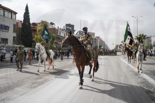 epa12578981 Syrian Army soldiers during a parade marking the first anniversary of the ousting of the Bashar al-Assad regime, in Damascus, Syria, 08 December 2025. Syria marks the first anniversary of the overthrow of the Assad regime on 08 December when the dictatorship of Bashar al-Assad collapsed during a major offensive by opposition forces.  EPA/AHMAD...