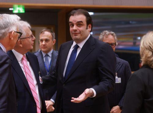 epa12585164 Greek Finance Minister Kyriakos Pierrakakis (R) at the start of Eurogroup  Finance ministers Council in Brussels, Belgium, 11 December 2025. The Eurogroup will elect a President for the upcoming new term of office, in line with Protocol (No 14) on the Eurogroup, annexed to the EU treaties. Vincent Van Peteghem, Belgium's Finance Minister, and...