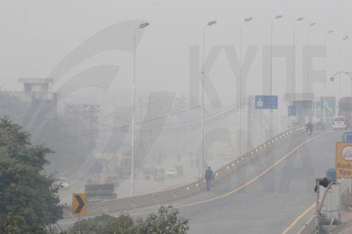 epa12587640 Vehicles drive on a road amid heavy smog in Lahore, Pakistan, 12 December 2025. Punjab’s air quality worsened sharply as Lahore topped global pollution rankings, with dense smog spreading across the province. Authorities issued alerts, intensified inspections, and deployed drones, while health advisories urged residents to limit outdoor activity...