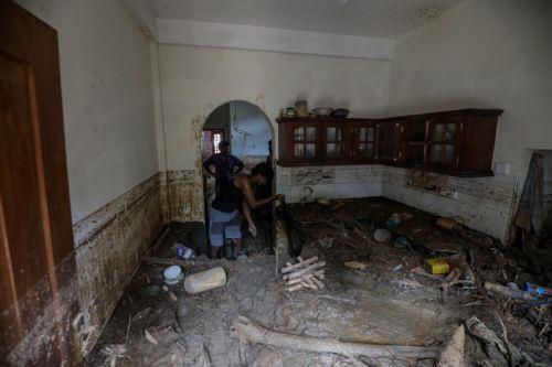 epa12587680 Landslide victims remove mud and debris from their damaged house after landslides in Badulla, Sri Lanka, 12 December 2025. Many parts of the island had been inundated, and there had been many landslides due to Cyclone Ditwah. According to the Sri Lanka Disaster Management Center, More than 630 people have been killed, and 193 are missing around...