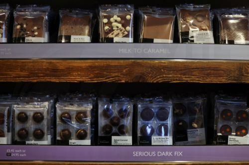 epa12594186 Chocolate on shelves at a Hotel Chocolate store in London, Britain, 15 December 2025. Britain's favorite chocolates are shrinking and becoming more expensive ahead of Christmas as rising cocoa prices continue to put pressure on manufacturers. Global cocoa production has fallen by more than 14 percent this year, while cocoa prices have quadrupled...
