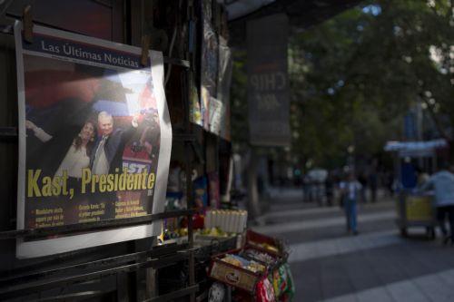 epa12594398 Photograph of a newspaper announcing the results of the presidential elections in Santiago, Chile, 15 December 2025. The far-right Jose Antonio Kast won the second round of the presidential elections in Chile on 14 December.  EPA/ADRIANA THOMASA